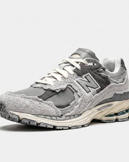 New Balance M2002 Protection Pack Grey — 3/4 studio angle