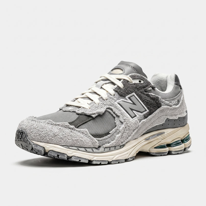 New Balance M2002 Protection Pack Grey — 3/4 studio angle