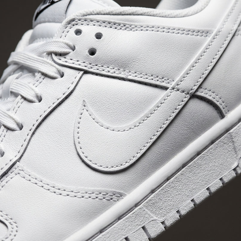 dunk low triple white — Premium detail close-up