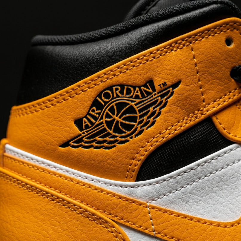 jordan 1 mid university gold — Premium detail close-up
